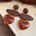 Handmade ethnic style wooden heart drop earrings with amber resin pendant for women - Amber Brown
