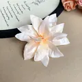 Detailed close-up view of a vintage cream lily flower hair clip with delicate petal textures - Lily Flower (HH7384) / Single Piece / Off White