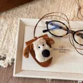 Charming plush cartoon dog head pendant with long brown adjustable cord on aesthetic tray - Dog (45# Necklace)