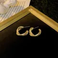 Elegant matte gold-finish geometric twisted multi-layered hoop earrings for women - Triple Layer Wire Hoop