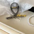 Elegant translucent grey hair claw clip with stylish gold-tone metal logo lettering - Minimalist Letter Style / 34# Haze Blue Hollow Butterfly Claw