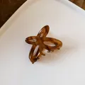 Elegant brown tortoiseshell butterfly hair claw clip with a chic minimalist design - Butterfly Tortoiseshell Style / Light Coffee
