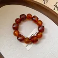 Close-up of translucent brown acrylic beaded bracelet with irregular geometric shapes - Dark Coffee