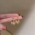 Elegant golden frame dangle earrings featuring sparkling irregular amber crystal stones - Square Crystal (46#)