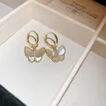 Elegant gold butterfly hoop earrings with iridescent shell wings and sparkling crystals (84 characters) - Ear Buckle (63#)