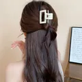 Simple cream white rectangular hair claw clip for women shown on long brown hair - Hollow Rectangle Style / Apricot