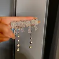 Exquisite sparkling rhinestone bow knot tassel drop earring in polished silver finish - Bow Double Tassel (Style 17)