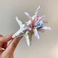 Close-up detail of an elegant starfish hair clip featuring cloth flowers and pink rhinestones - Pink Starfish Flower (HH8278)