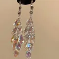 Close-up of ethnic style silver needle earrings with iridescent rhinestone tassels - 2# Silver Post - Silver AB Color