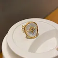 Close-up of an elegant baroque pearl ring with an intricate gold zircon star detail - Baroque Irregular Pearl Style / White