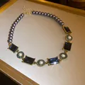 Detailed macro shot of a vintage French style pearl and navy square gem necklace - Necklace / Blue