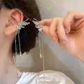 Detail of silver butterfly ear bone clip with long tassels and metallic texture - Butterfly Shape Tassel Ear Cuff (14)