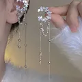 Detail of butterfly wing ear cuff with long silver-tone chain and pearl tassels - Rhinestone Tassel Butterfly Ear Cuff (25)