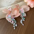 Detailed view of handmade pink chiffon flower earrings with resin hearts and beads - Heart Flower Tassel Style / Pink, Purple