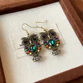 Close-up of vintage bronze owl drop earrings with green teardrop crystal and colorful beads - Owl Hollow Water Drop (HE23805) / Gold-Multicolor