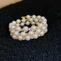 Elegante dreireihige Perlenarmband mit goldfarbenen Strasssteinen Detailaufnahme - Spiral-Perlen-Stil (11#)