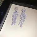 Elegant sparkling zircon leaf tassel drop earrings with high-shine silver finish. - Leaf Tassels