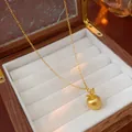 Elegant gold-plated apple pendant necklace with fine chain displayed in a wooden jewelry box - Gold (Real Gold Plated)
