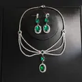 Close-up of elegant green emerald-cut crystal necklace and earrings jewelry set on black box - Necklace And Earrings Set (4#) / Silver-Green