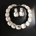 Detailed macro view of luxurious crystal necklace and matching earring jewelry set - Necklace And Earrings Set (18#) / Silver Clear Crystal