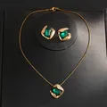 Elegant emerald green crystal jewelry set featuring gold-toned necklace and earrings. - Necklace And Earrings Set (22#) / Gold Emerald Green Rectangle