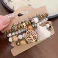Close-up of Bohemian multi-layer beaded bracelet set with Tree of Life charm and tassel details - Tree of Life Pendant Style (13#) / White