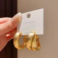 Orecchini a cerchio dorati multistrato su cartoncino, gioielli alla moda per donna - Oro