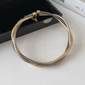 Elegant multi-layer twisted metal choker necklace in gold and silver finish for women - Two-Tone Gold & Silver