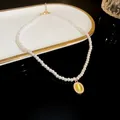 Elegant close-up of a pearl choker necklace featuring a light green cat eye stone pendant - Oval Green Stone Style (4#)