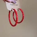 Vibrant red textured hoop earrings with hammered spray-painted finish. - Large Hoop Earrings (46#)