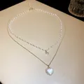 Elegant double-layered gold-plated necklace featuring a pearl chain and heart pendant - Double Layer Heart Style (11#)