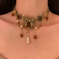 Vintage punk butterfly choker necklace with rhinestones and pearl pendant worn by model - 25# Butterfly Tassel Faux Pearl Style (25#) / Gold-Silver