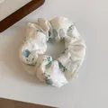Elegant white scrunchie with blue floral pattern and soft textured chiffon fabric for women - Scrunchie / Blue Flower