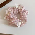 Pink and white gingham scrunchie with delicate white bows and elegant pearl accents - Scrunchie / Pink Plaid