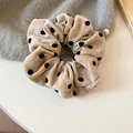Elegant cream velvet hair scrunchie featuring classic black polka dots for stylish hair styling - Scrunchie / Khaki Flocked Polka Dot