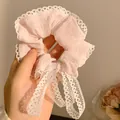 Sweet pink lace scrunchie with long ribbons for elegant hairstyling and soft look. - Scrunchie / Pink Bowknot