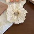 Elegant beige lace scrunchie with floral embroidery for stylish women's hair styling. - Scrunchie / White Lace