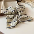 Elegant navy and white striped fabric hair scrunchie with a gold heart charm detail - Scrunchie / Cream Square Striped