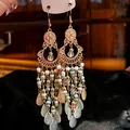 Detail view of bohemian tassel earrings with colorful beads and crystal drops. - Hook Style / Multicolor (Gold-Pink-Green-Blue)