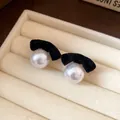 Elegant black flocked bow pearl stud earrings with silver needles for autumn and winter - Black