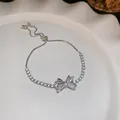 Sparkling cubic zirconia bow adjustable bracelet in elegant silver-plated finish - Rhinestone Bow Bracelet / Silver