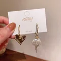 Asymmetric geometric earrings with crumpled heart and white pearls, 925 silver post. - Heart