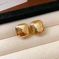 Elegant vintage-inspired gold-tone square stud earrings with unique hammered texture - Square Hammered Stud Earrings / Gold