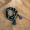 Close-up detail of Bohemian multi-layer beaded bracelet featuring blue tassels and wood beads - 4# Bangle (4#) / 6-Piece Set / Blue