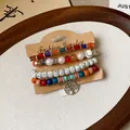 Detail view of four-layer beaded bracelets on display card with tree of life charm. - 11# Bangle (11#) / Four-Piece Set / Colorful