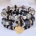 Close-up detail of multi-layer black beaded bracelet set with gold heart charm - 27# Bangle (27#) / Four-Piece Set / Black