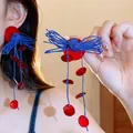 Statement blue rope tassel earrings with red resin charms in a retro style. - Style 73 Disc Pendant (5942177792995) / Red and Blue