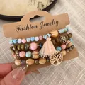 Detailed macro shot of a four-piece bohemian wood and stone beaded bracelet set - 36# Bangle (36#) / Pink/Branch