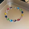 Close-up of a colorful oval zircon bracelet with sparkling gemstones on a gold tray - 2# Silver Multi-color