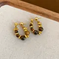 Elegant golden U-shaped earrings featuring brown tiger eye beads and silver needles - U-Shaped Beaded Style (41#)